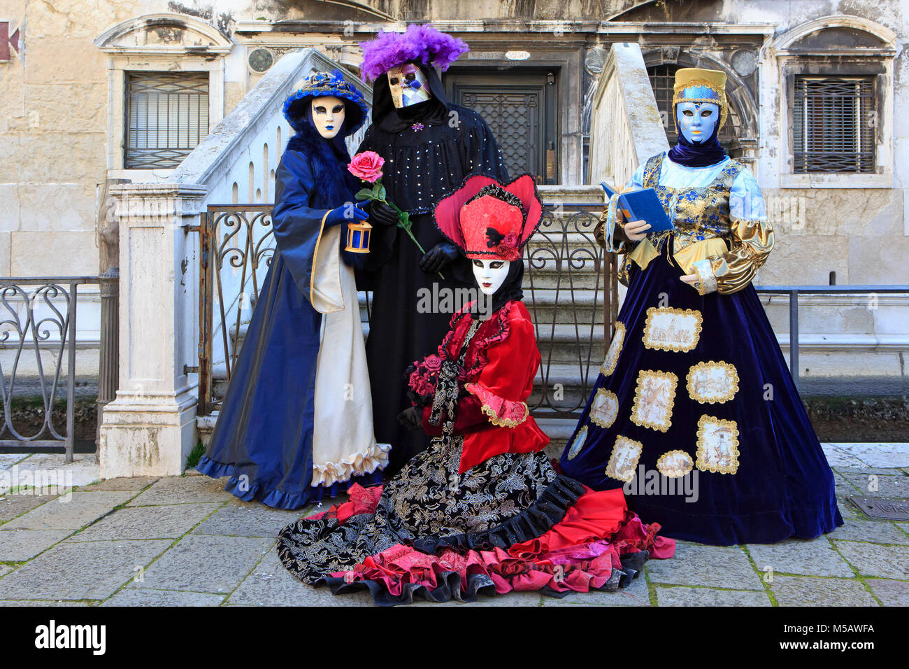 Four costumed people during the Carnival of Venice (Carnvele di Venezia) in Venice, Italy Stock Photo