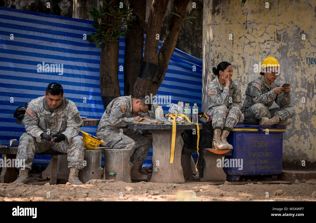 U.S. Army Soldiers take a break during construction of a school building in support of Exercise Cobra Gold 2018 at Nongphipadungkitwittaya School in Korat, Kingdom of Thailand, Feb. 7, 2018. Humanitarian civic assistance projects conducted during the exercise support the needs and humanitarian interests of the Thai people. Cobra Gold 18 is an annual exercise conducted in the Kingdom of Thailand held from Feb. 13-23 with seven full participating nations. (U.S. Marine Corps Stock Photo