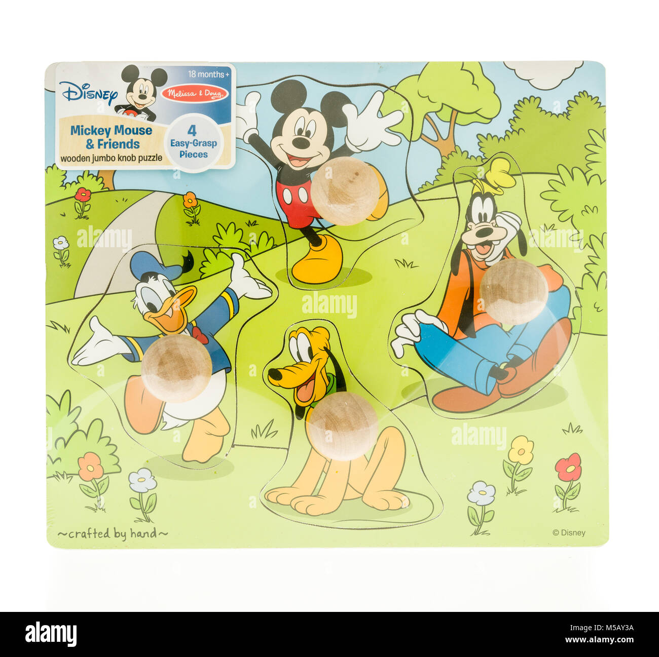 Winneconne, WI - 19 November 2017: A package of Disney puzzle featuring Mickey Mouse, Donald Duck, Goofy and Pluto on an isolated background. Stock Photo