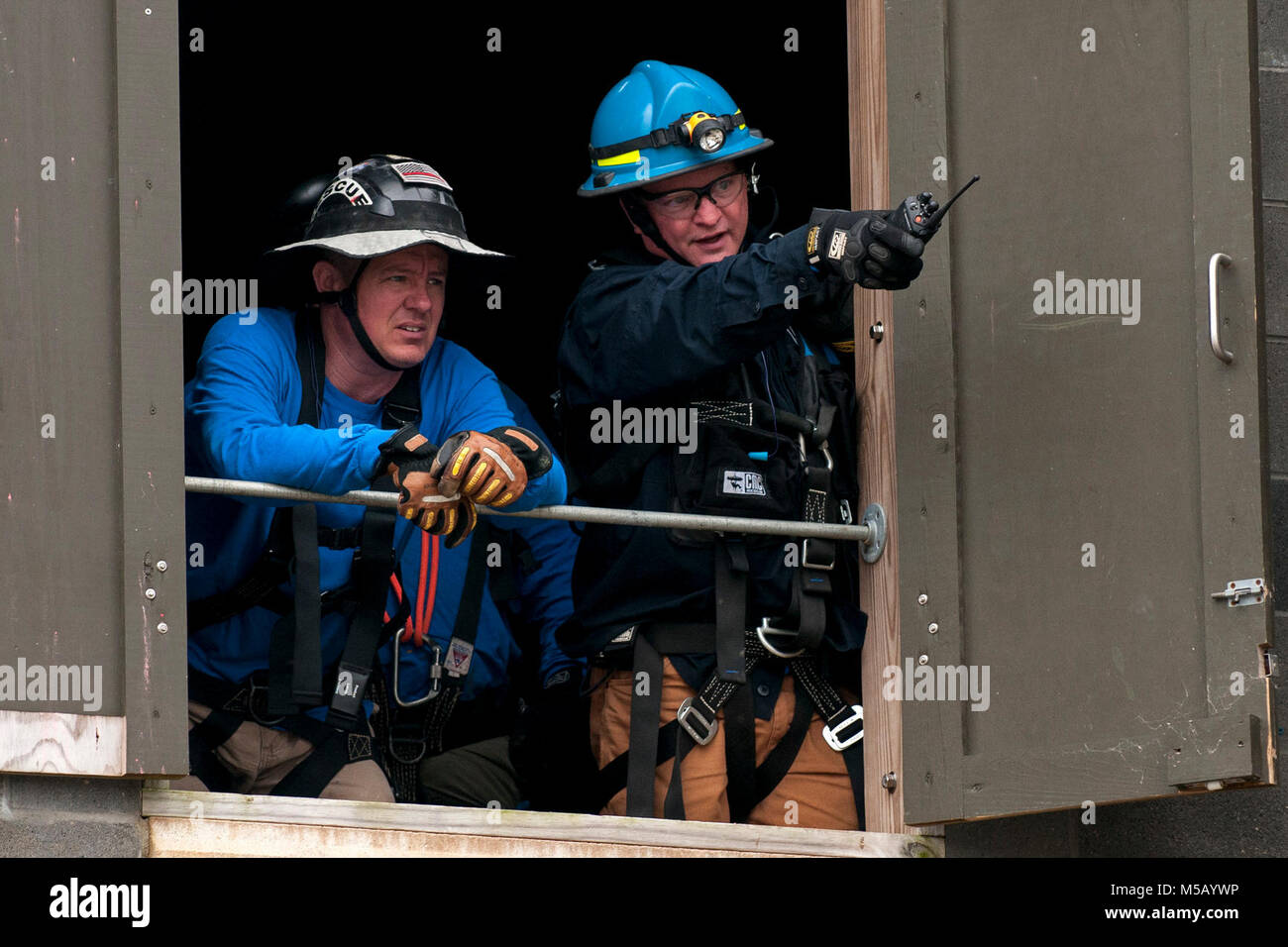 Members of the Mississippi Task Force Urban Search and Rescue Team simulate responding to victims in a collapsed structure during the PATRIOT South 2018 exercise at Camp Shelby, Miss., Feb. 14, 2018. PATRIOT South 2018 tests the combined abilities of the National Guard, along with state and local agencies, to respond during natural disasters using simulated emergency scenarios. (U.S. Air National Guard Stock Photo