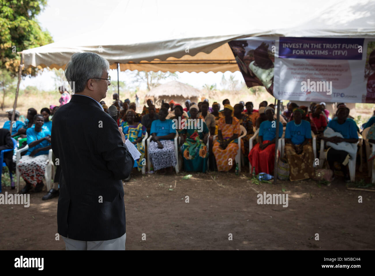 Awach, Gulu, Uganda. 22nd Feb, 2018. Judge O-Gon Kwon, president of the Assembly of State Parties to the ICC, addresses victims of LRA violence in Awach. He said it was the first time in his long career he had come face-to-face with victims of war crimes outside the courtroom, and thanked them for sharing their stories. Credit: Sally Hayden/SOPA/ZUMA Wire/Alamy Live News Stock Photo