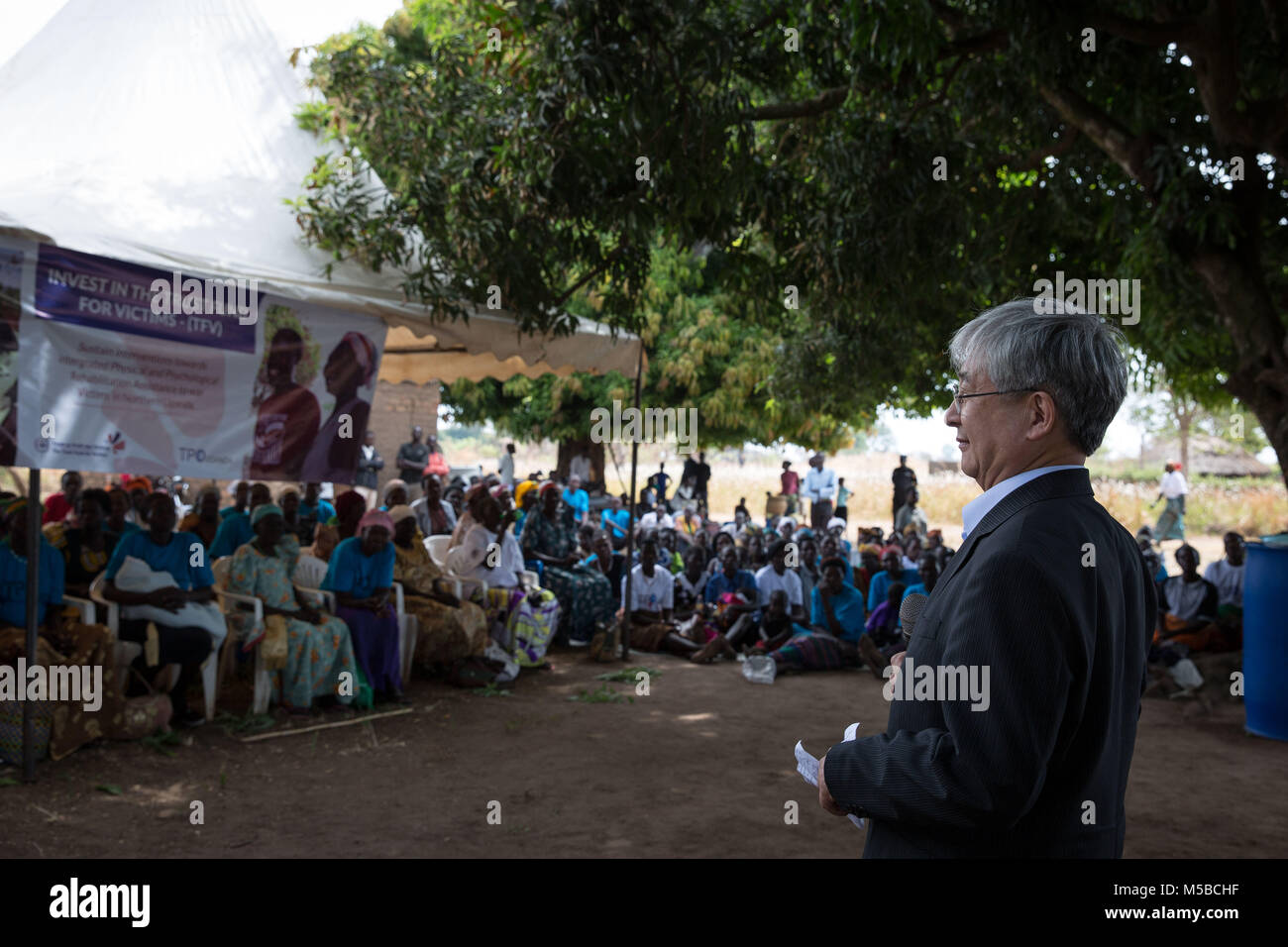 Awach, Gulu, Uganda. 22nd Feb, 2018. Judge O-Gon Kwon, president of the Assembly of State Parties to the ICC, addresses victims of LRA violence in Awach. He said it was the first time in his long career he had come face-to-face with victims of war crimes outside the courtroom, and thanked them for sharing their stories. Credit: Sally Hayden/SOPA/ZUMA Wire/Alamy Live News Stock Photo
