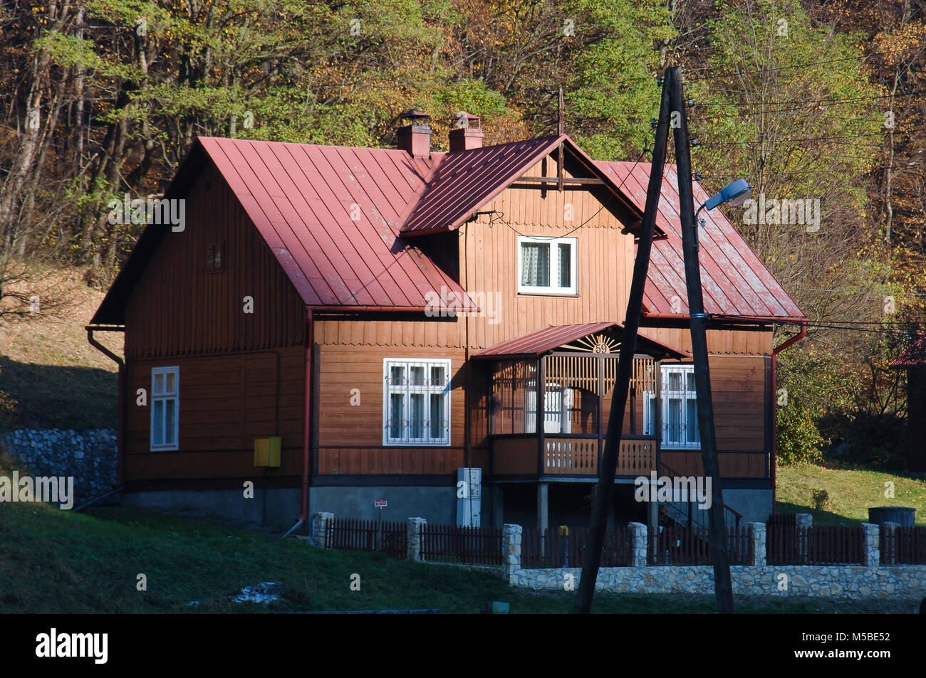 House In The Forest with Trees with Golden Dry Leaves Stock Photo - Alamy