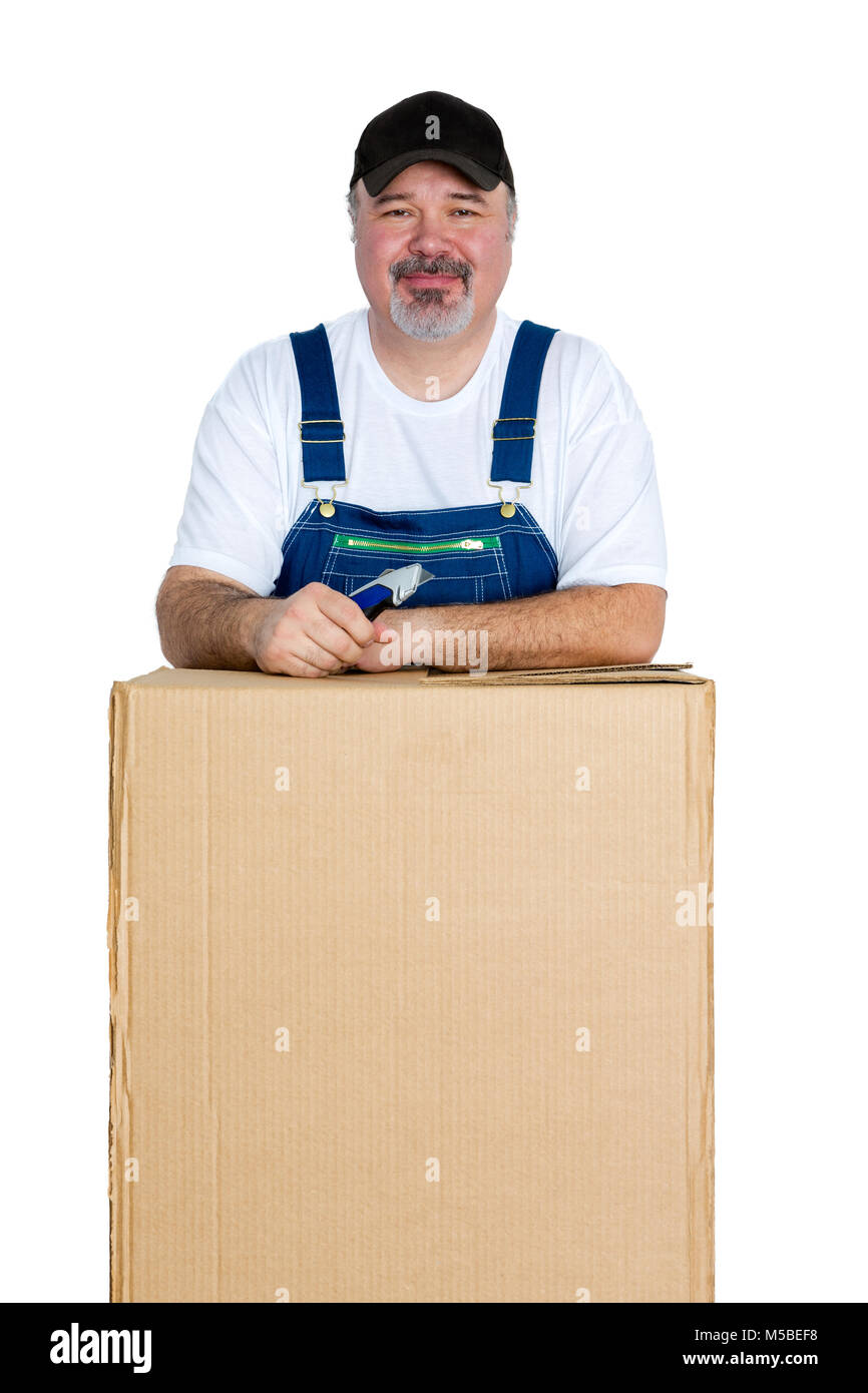Portrait of cheerful man standing over large cardboard box against white background Stock Photo