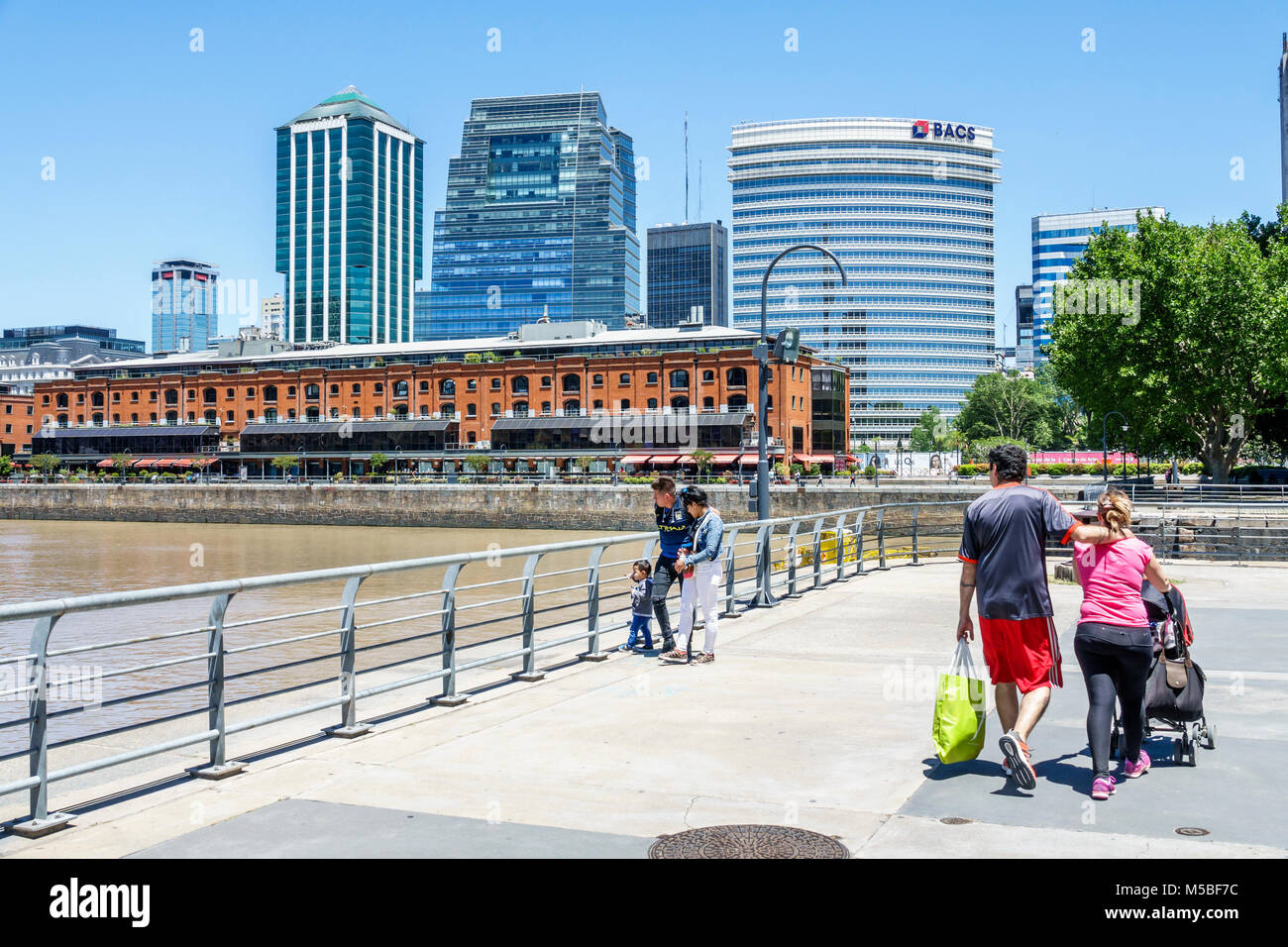 Buenos Aires Argentina,Puerto Madero,Rio Dique,water,riverfront,former dock warehouses,conversion,adaptive reuse,city skyline,family families parent p Stock Photo