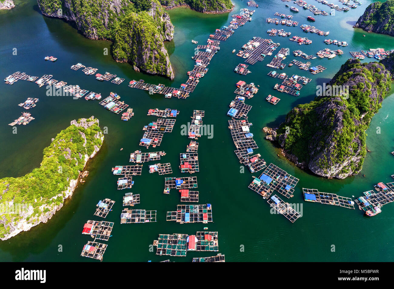 Floating fishing village and rock island in " Lan Ha " Bay, Vietnam, Southeast Asia. UNESCO