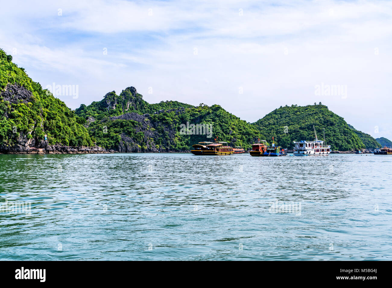 Floating fishing village and rock island in " Lan Ha " Bay, Vietnam, Southeast Asia. UNESCO