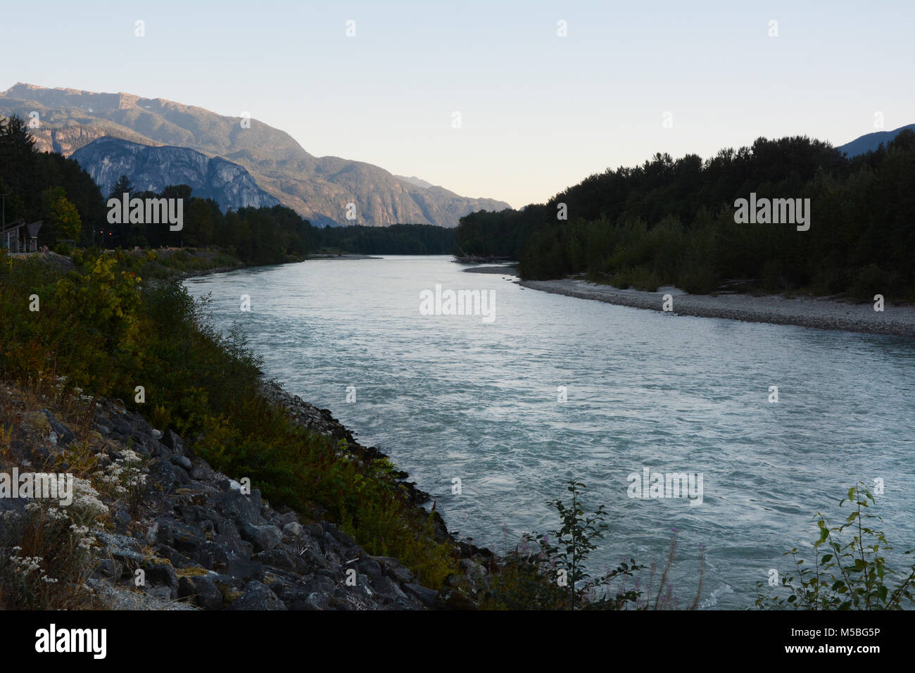 The Skeena River at dusk, running west of the city of Terrace, in Northern British Columbia, Canada. Stock Photo