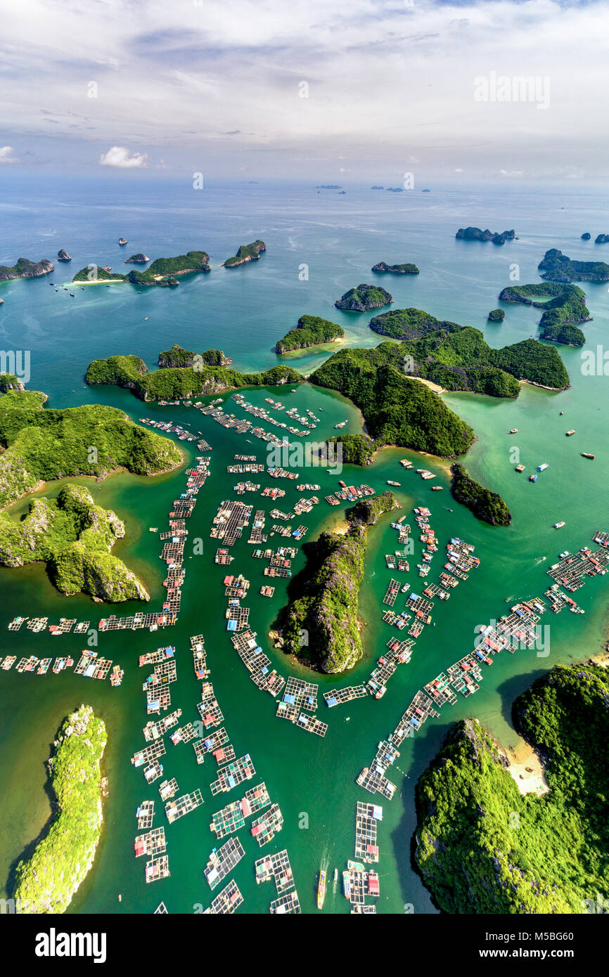 Floating fishing village and rock island in " Lan Ha " Bay, Vietnam