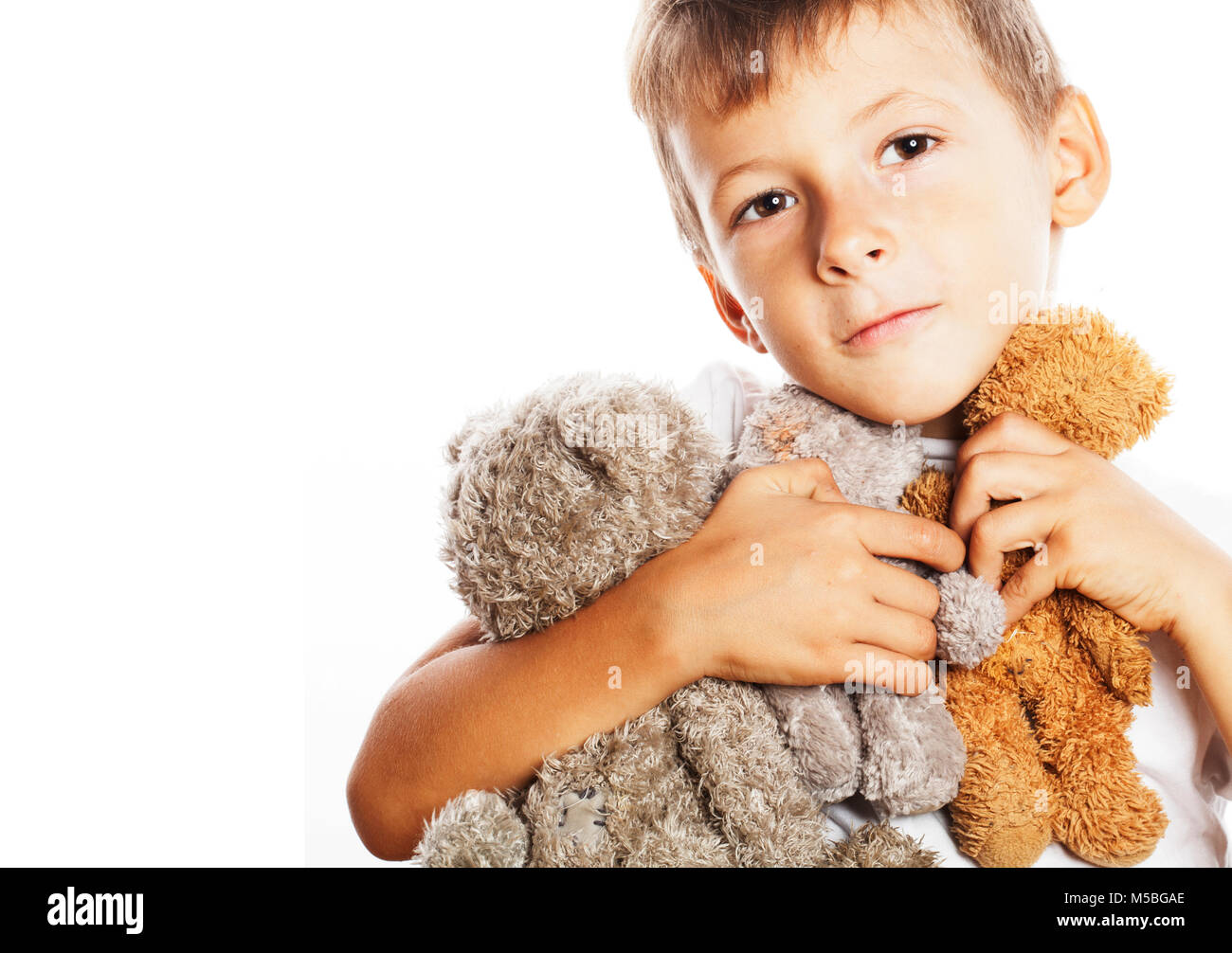 little cute boy with many teddy bears hugging isolated close up Stock ...