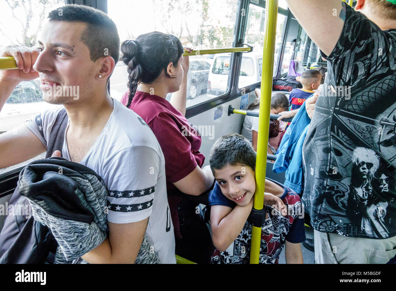 Buenos Aires Argentina,onboard public bus,transportation,Hispanic Latin Latino ethnic minority,boy boys,male kid kids child children youngster youngst Stock Photo
