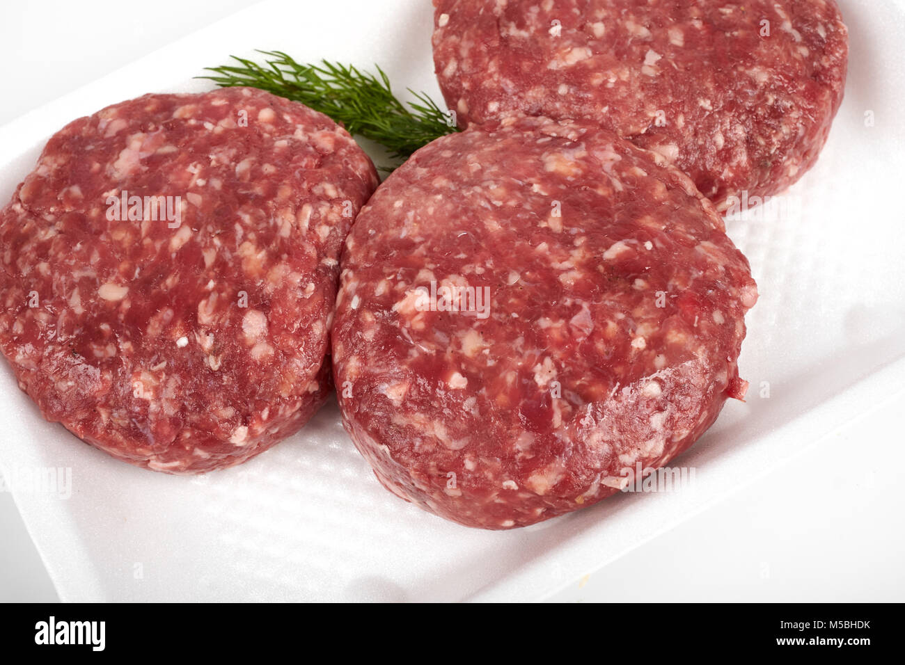 minced meat in plastic package isolated on white background Stock Photo