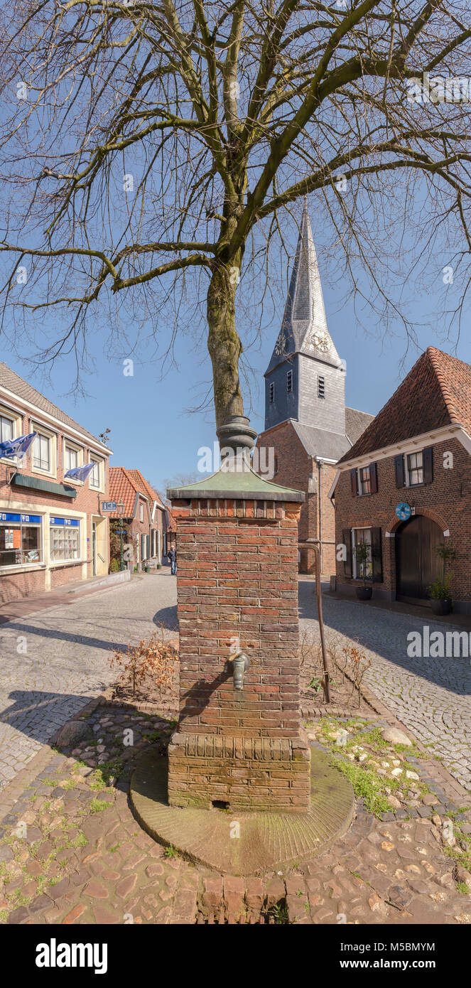 Marcket square with a pump and church Stock Photo Alamy