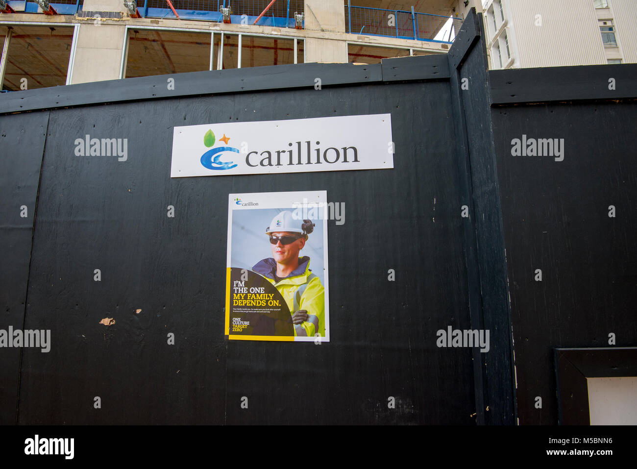 Carillion sign on a deserted building site, Salford, Greater Manchester. Carillion plc is a British multinational facilities management and constructi Stock Photo