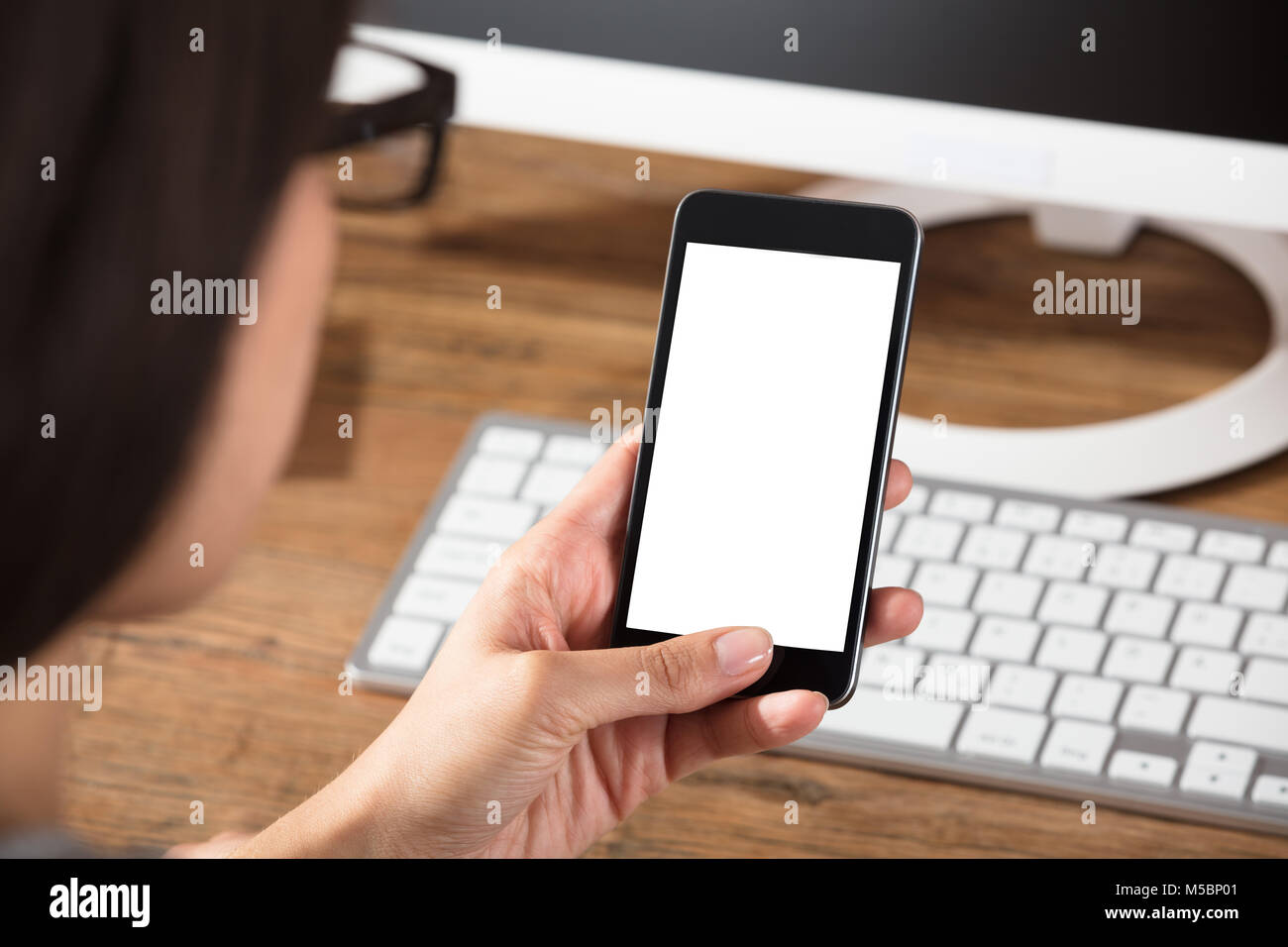 Close-up Of A Female Holding Cell Phone With Blank White Screen Stock ...