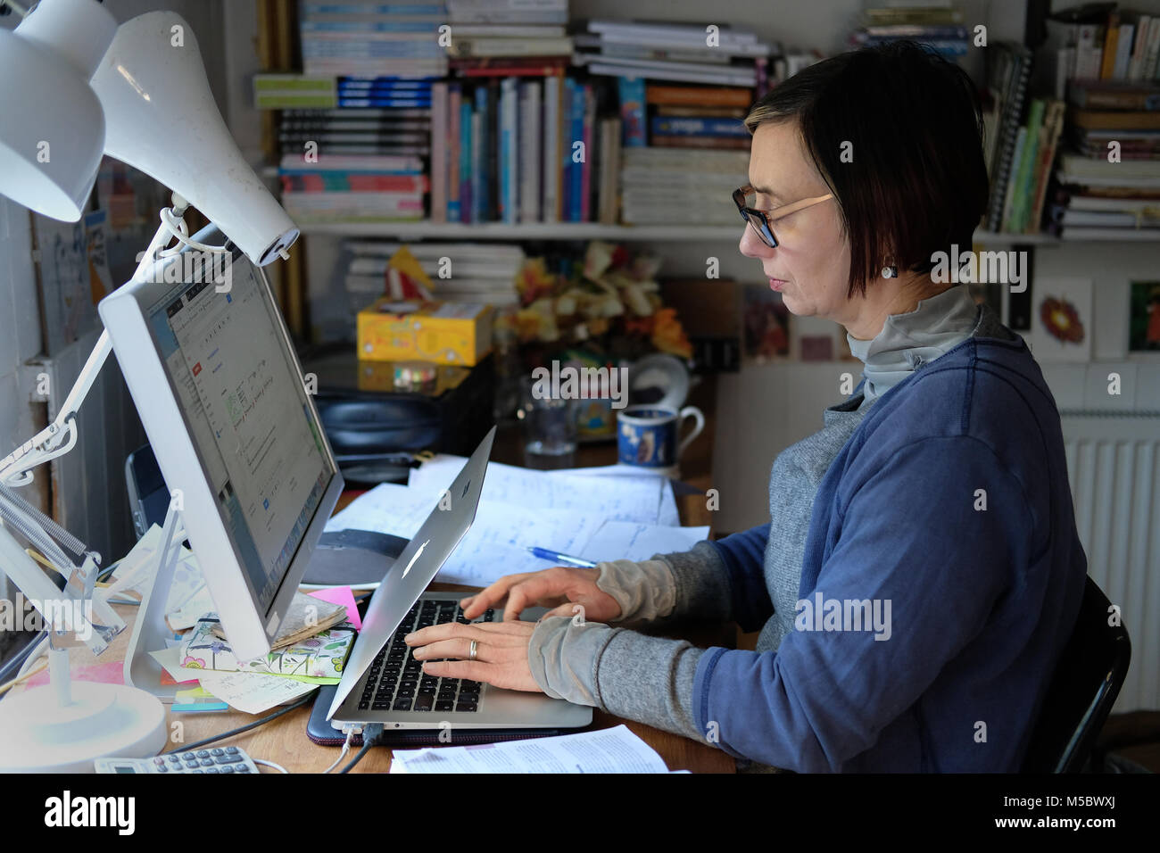 Woman working from home. Stock Photo