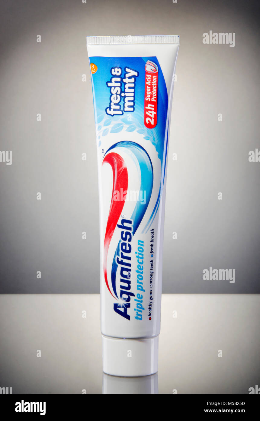 Aquafresh toothpaste isolated on gradient background Stock Photo - Alamy