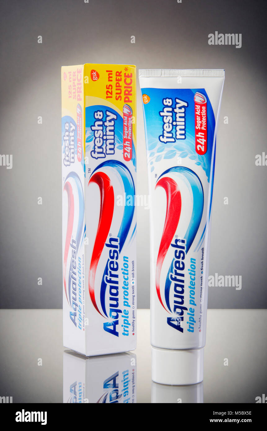 Aquafresh toothpaste isolated on gradient background Stock Photo - Alamy