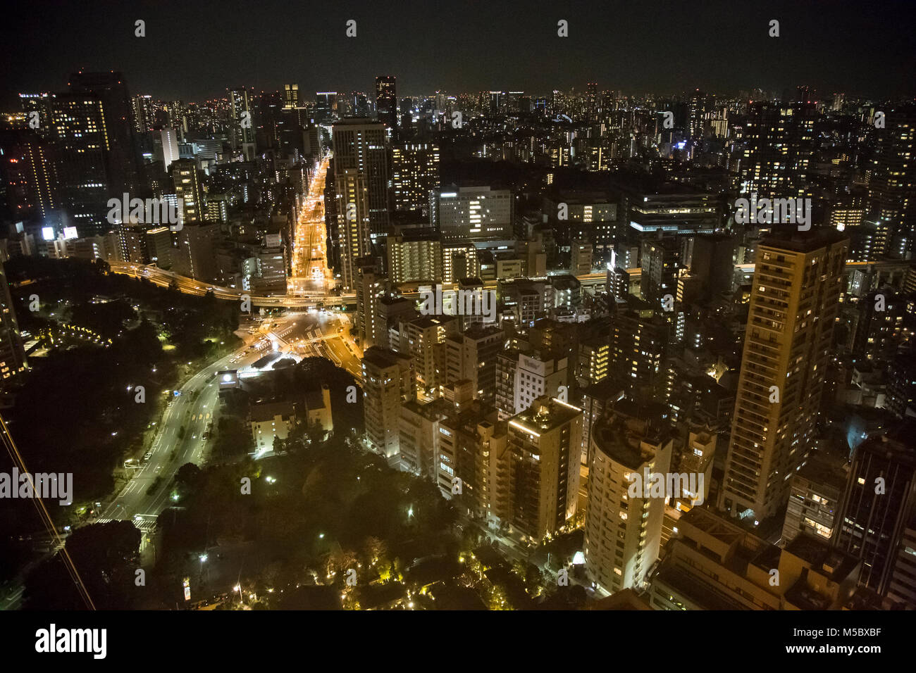 Views of the Tokyo cityscape and skyline at night, from atop Tokyo Tower in Tokyo. Stock Photo