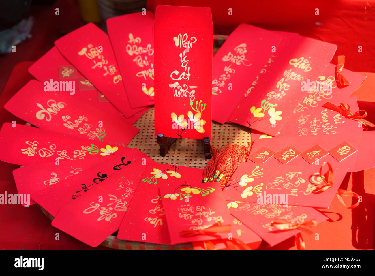 Red envelopes Lunar New Year Calligraphy decorated with text Merit,  fortune, longevity in Vietnamese means anyone receives money from envelope  Stock Photo - Alamy