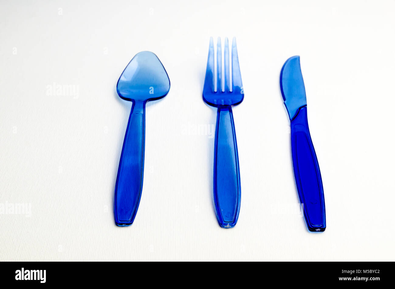 A Studio Photograph of Blue Plastic Cutlery Stock Photo