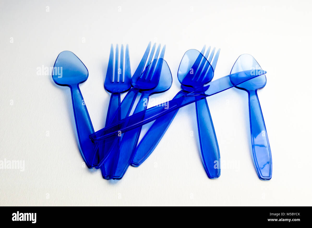A Studio Photograph of Blue Plastic Cutlery Stock Photo