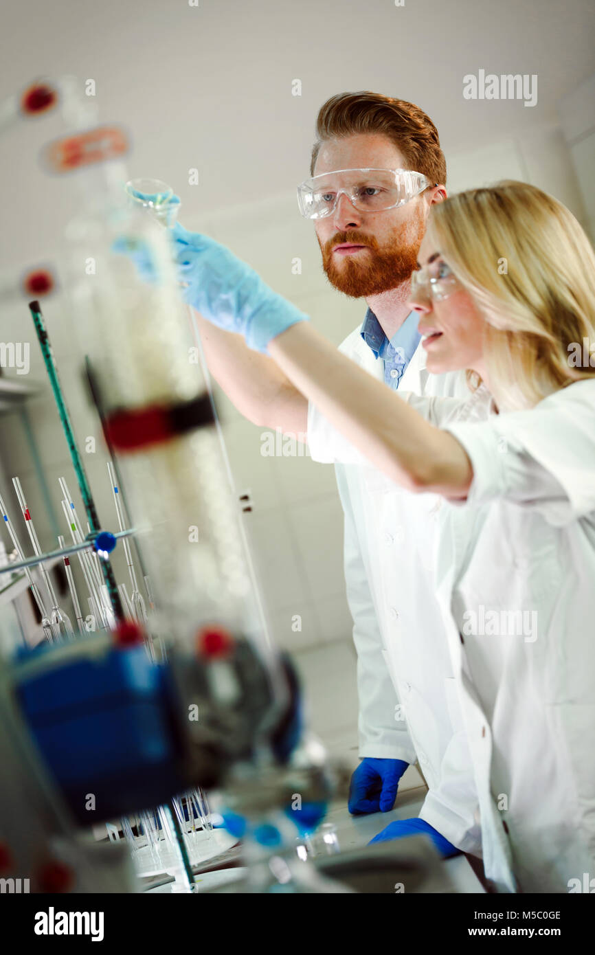 Group of chemistry students working in laboratory Stock Photo