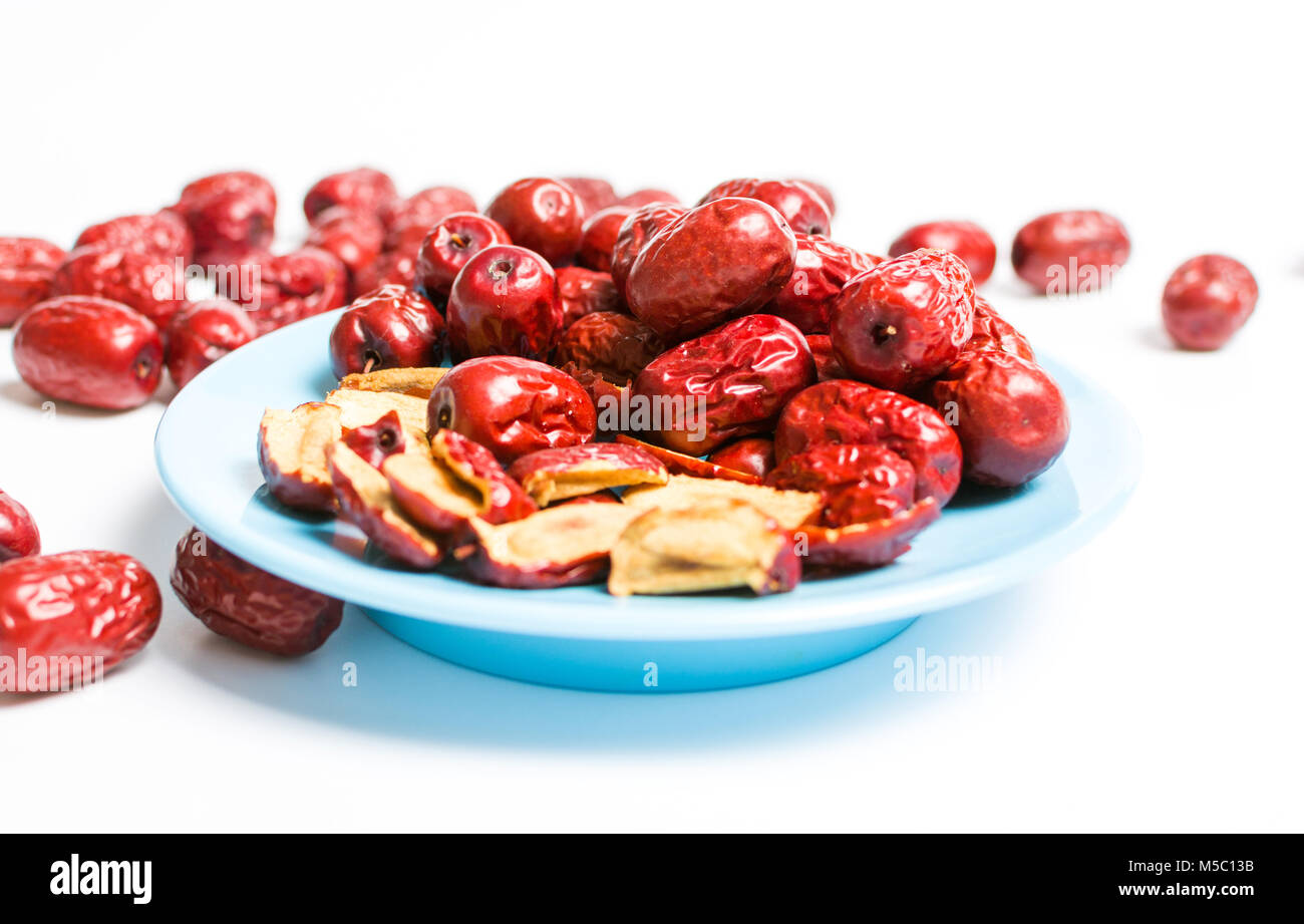 Jujube, Chinese dried red date fruit on a plate isolated Stock Photo