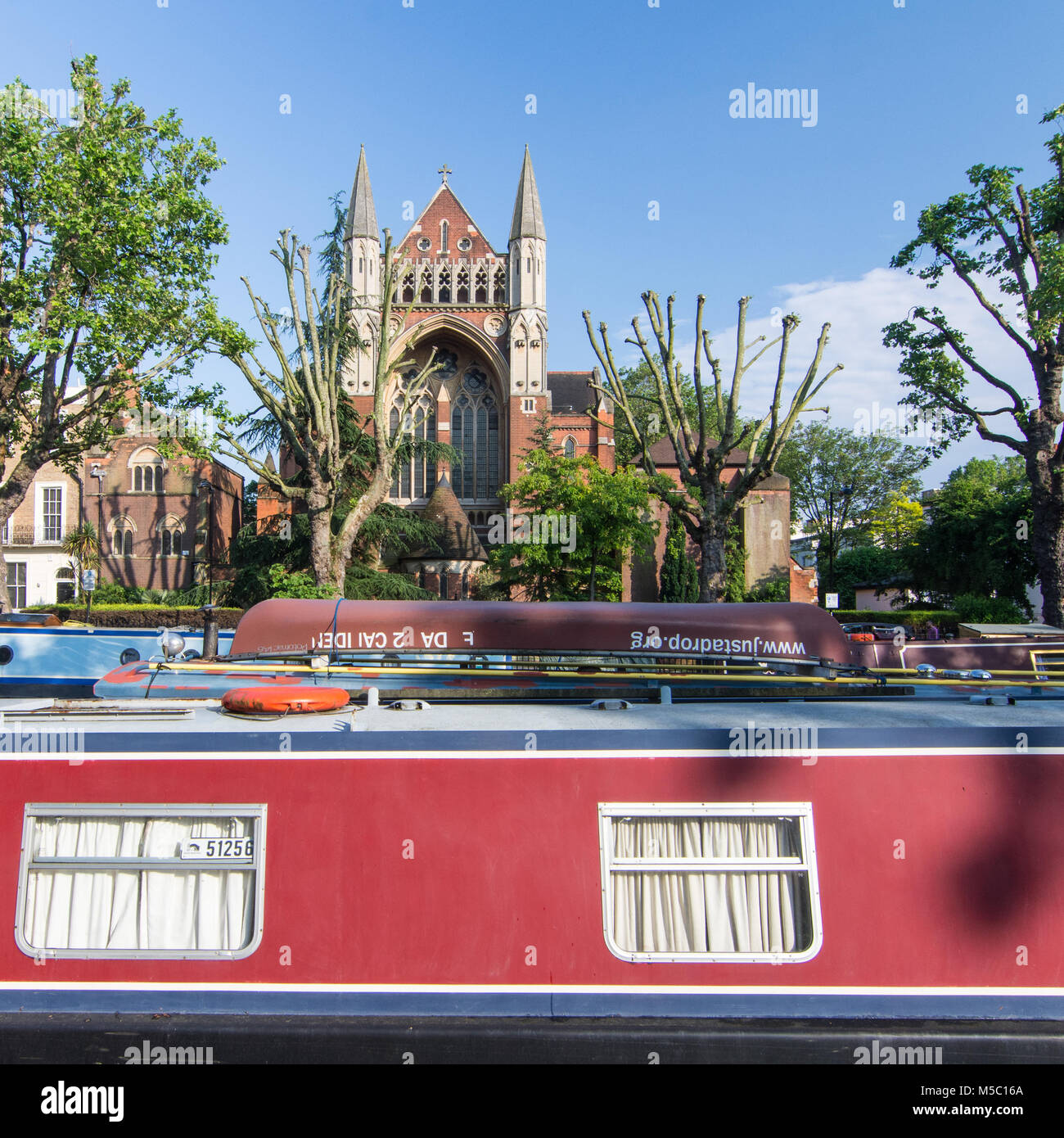 London, England - June 8, 2016: Traditional narrow boats moored on the Regent's Canal near Little Venice in the Maida Vale neighbourhood of London. Stock Photo