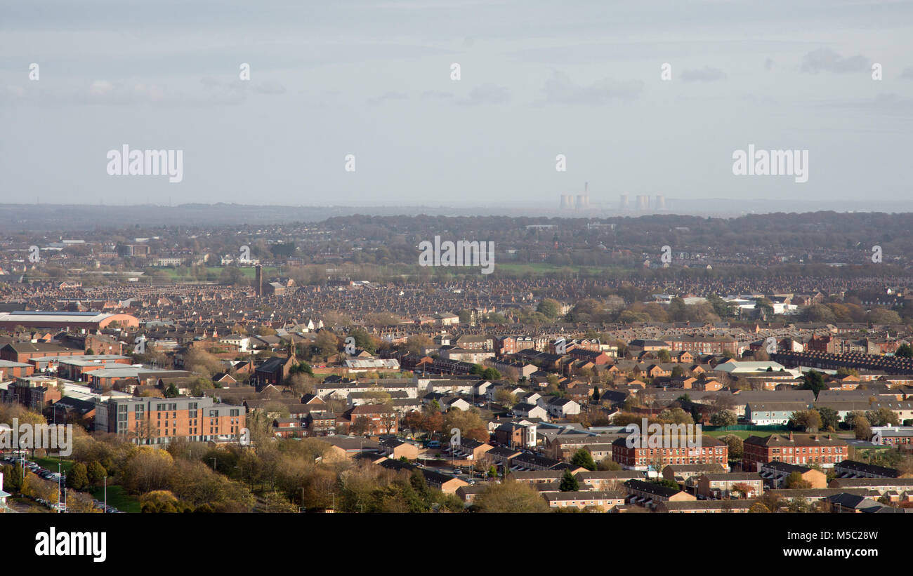 Liverpool, England, UK - November 9, 2017: Suburban housing sprawls across Liverpool, with Cheshire and Fiddlers Ferry Power Station in the distance,  Stock Photo