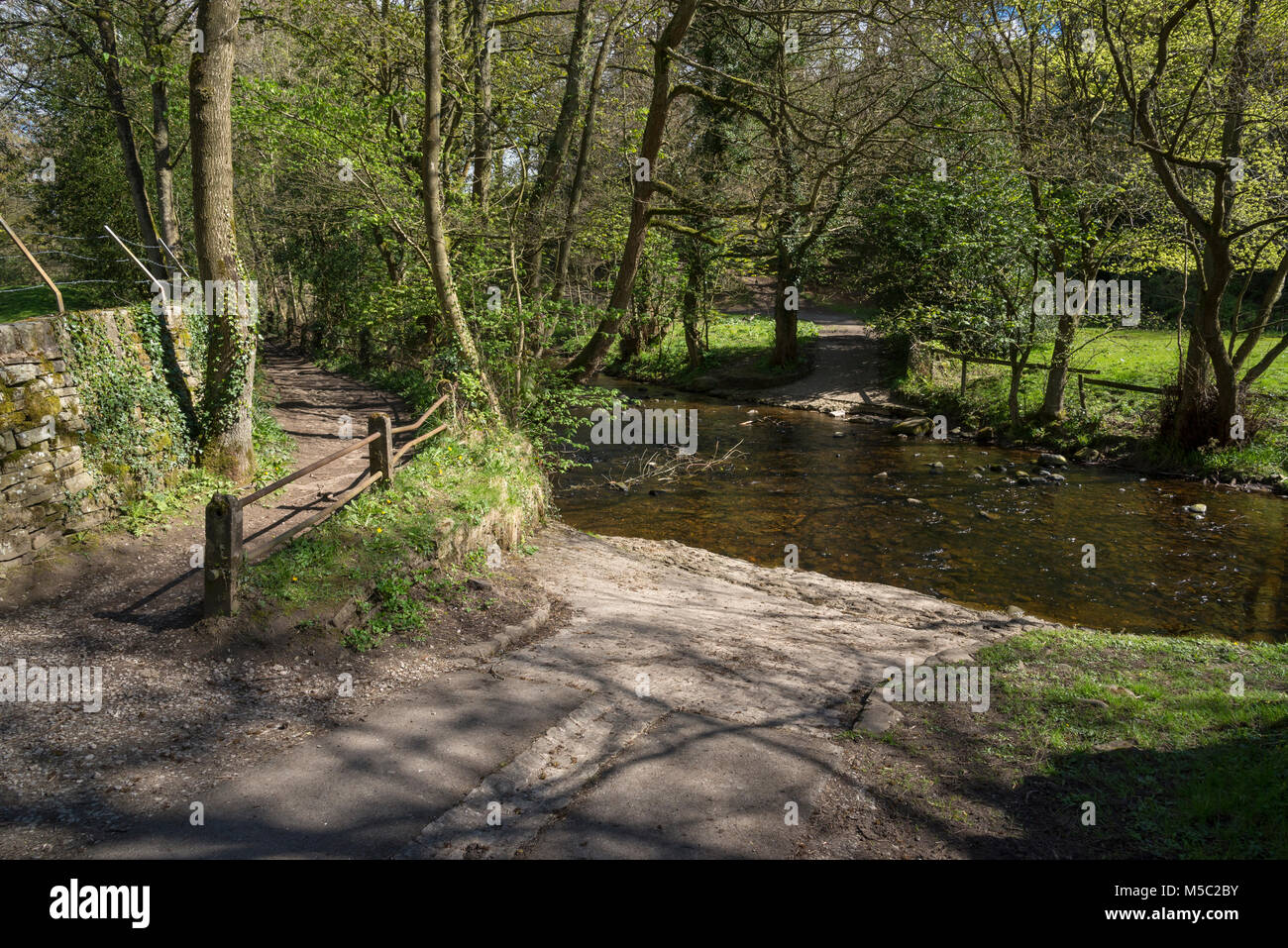 Ford and footbridge over the river Goyt at Taxal near Whaley Bridge, Derbyshire, England. Stock Photo