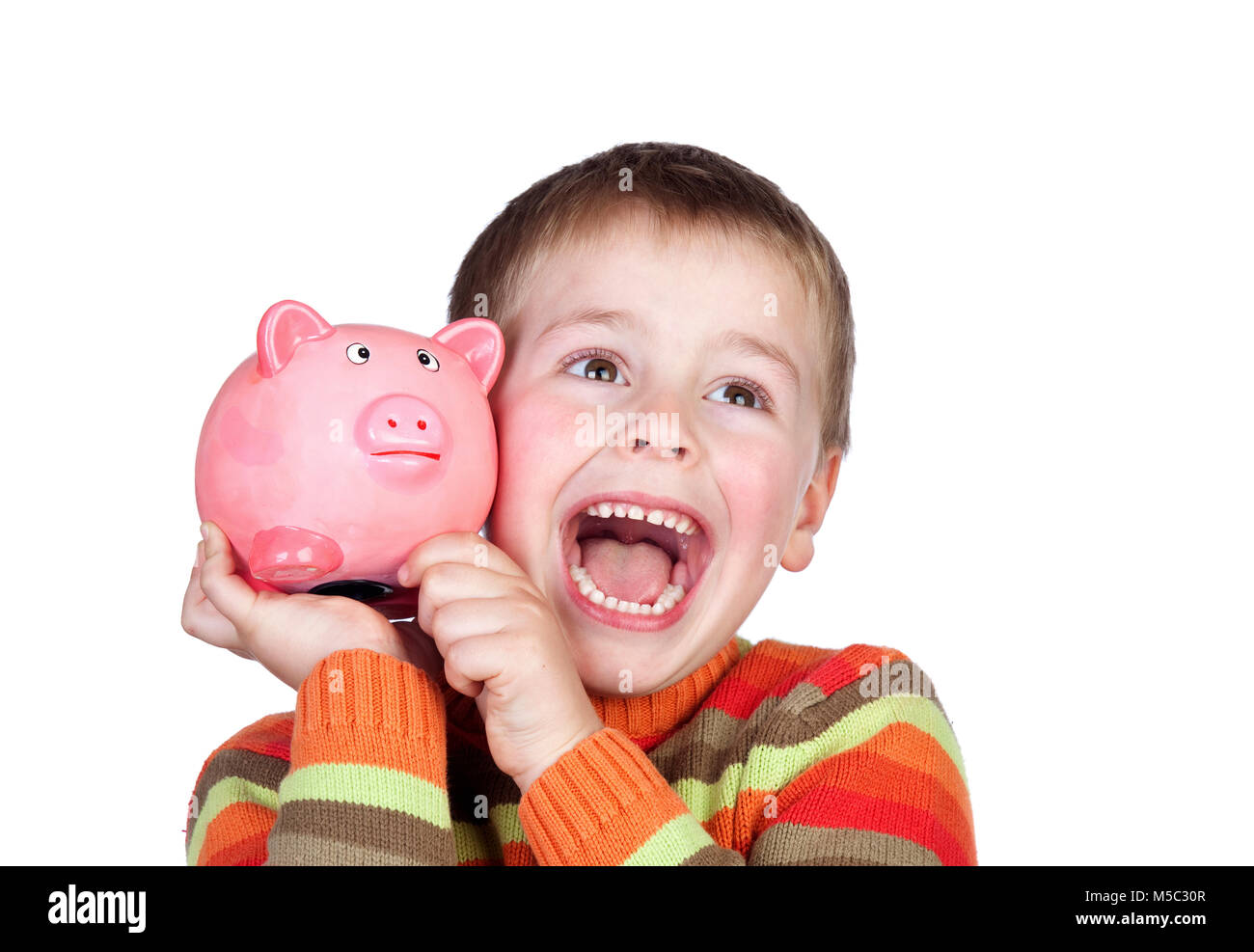 Happy child with blue money box isolated on a white background Stock