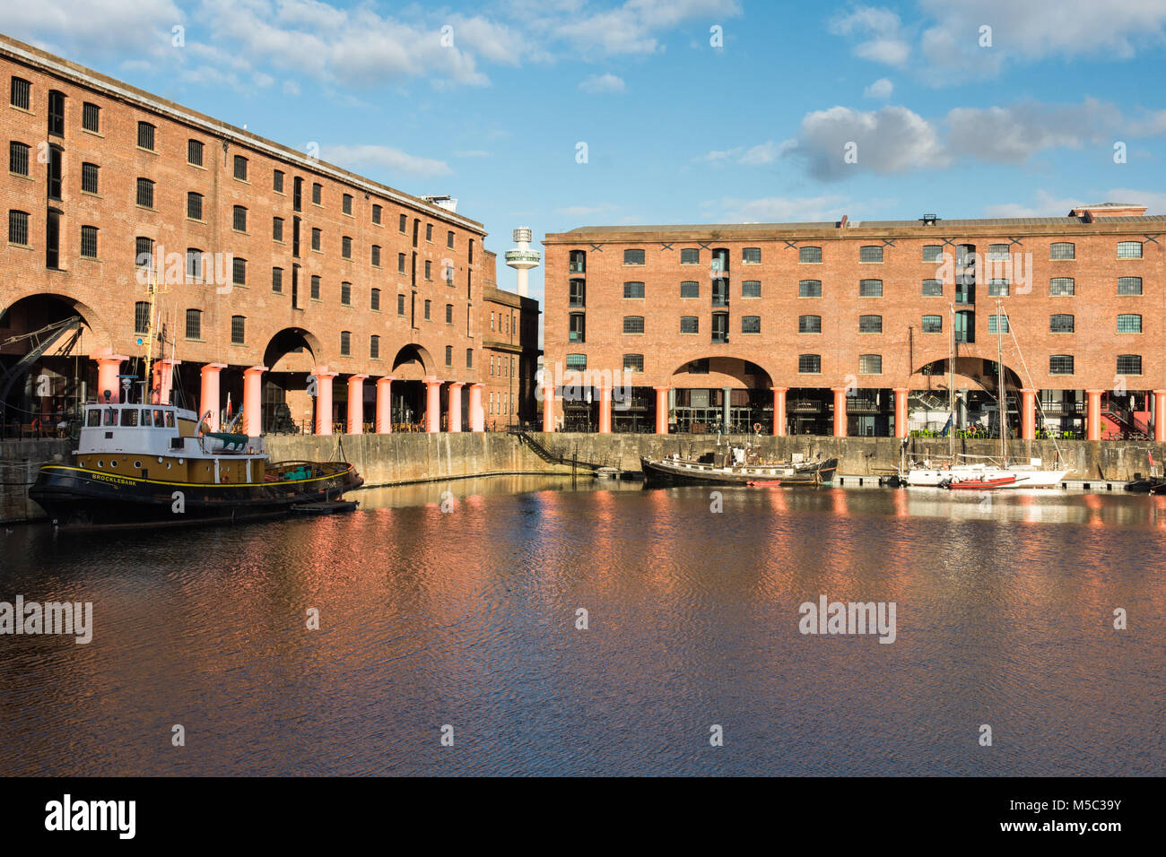 Liverpool, England, UK - November 11, 2016: Sun shines on the redeveloped Albert Dock in Liverpool's historic docks. Stock Photo