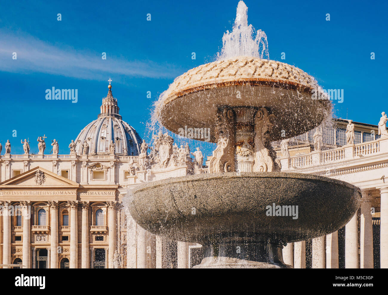 Saint Peter's Basilica and the fountain in front in Vatican, Rome