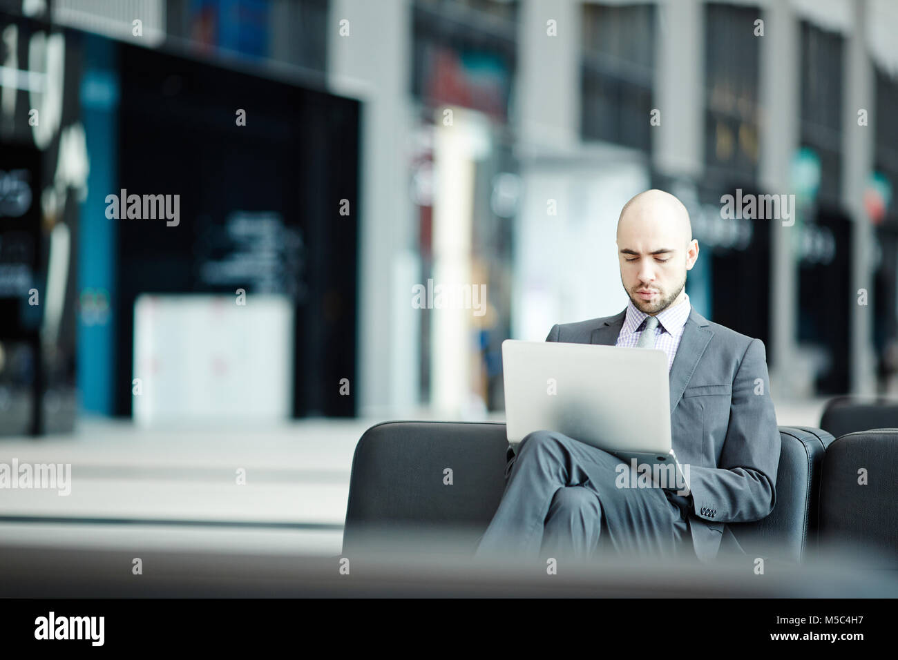 Businessman in lounge Stock Photo