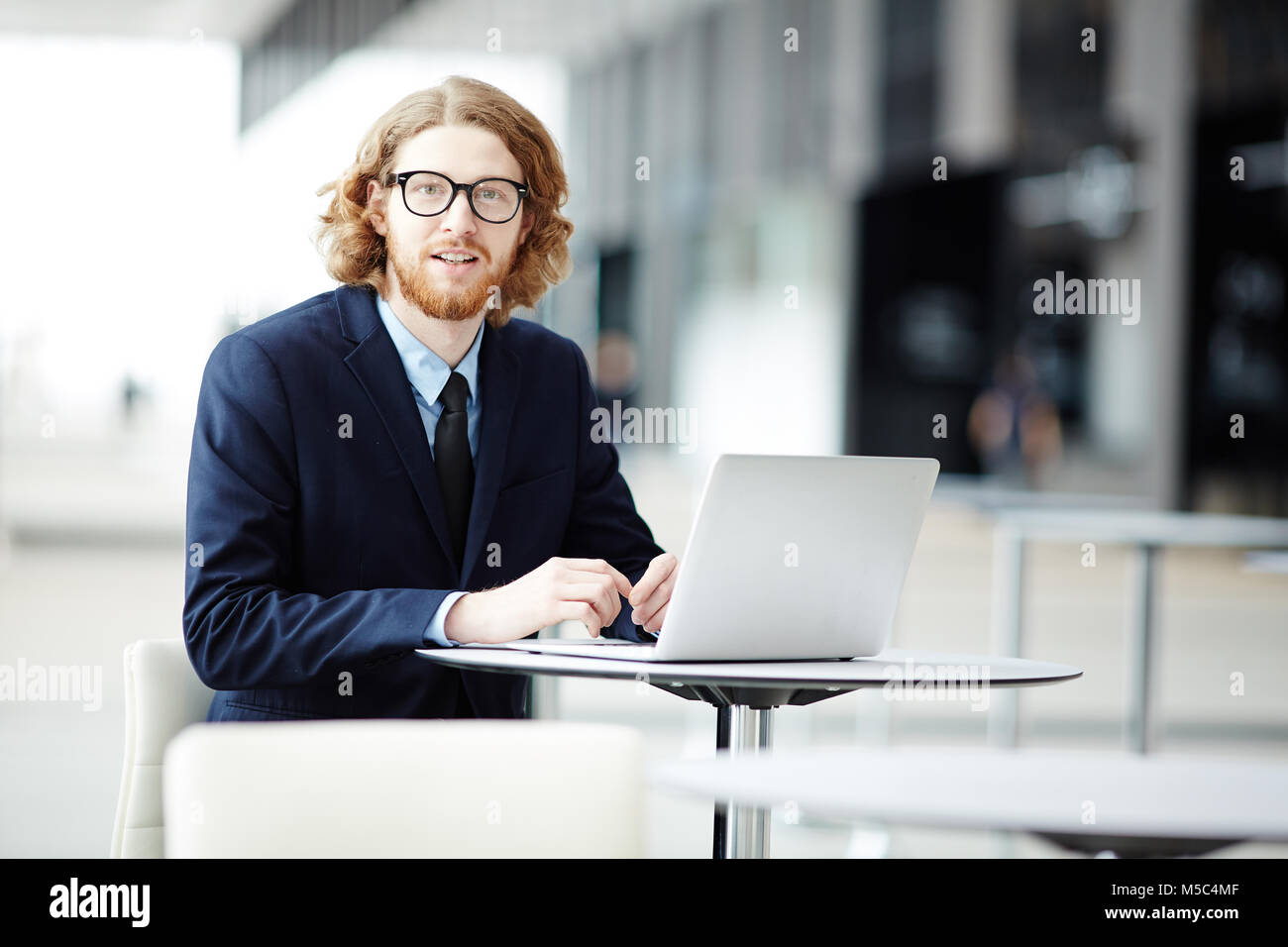 Working in airport lounge Stock Photo