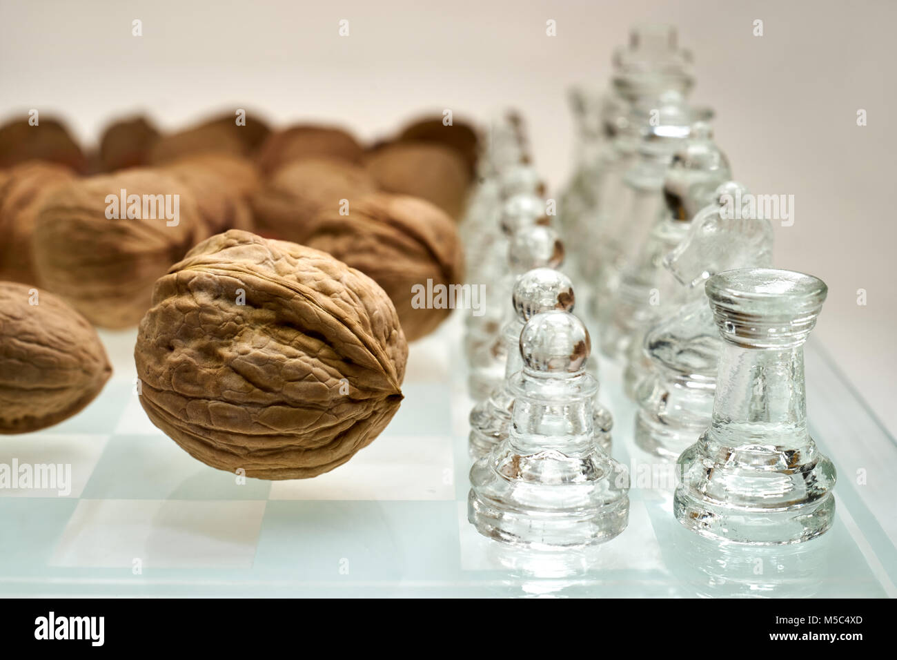 Nuts improve brain efficiency (visualization) - chess, chessboard with nuts Stock Photo