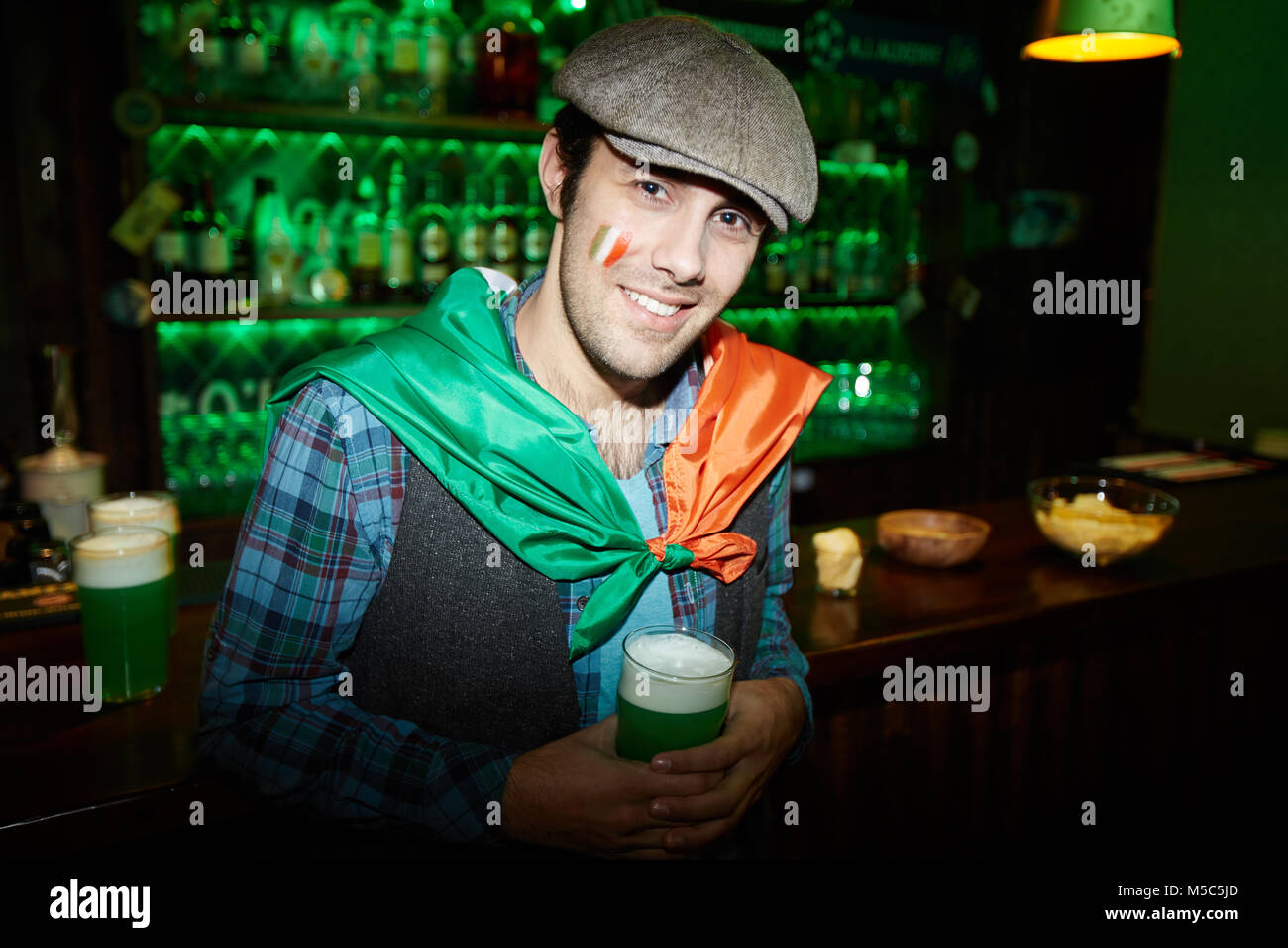 Young man in pub Stock Photo