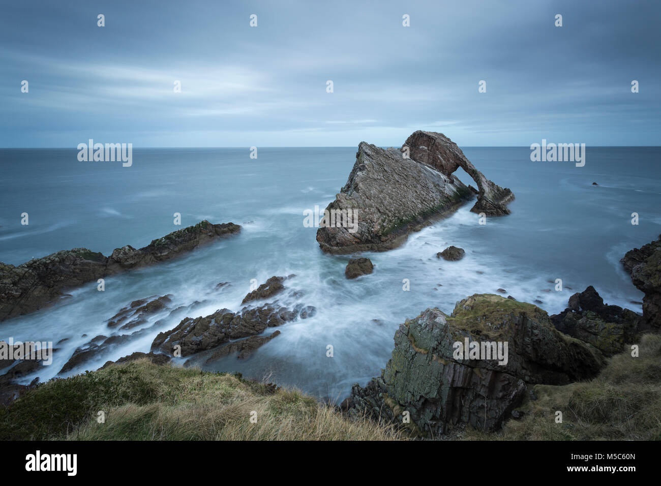 Bow Fiddle Rock near Portknockie, Moray, Scotland, UK. Long exposure image Stock Photo