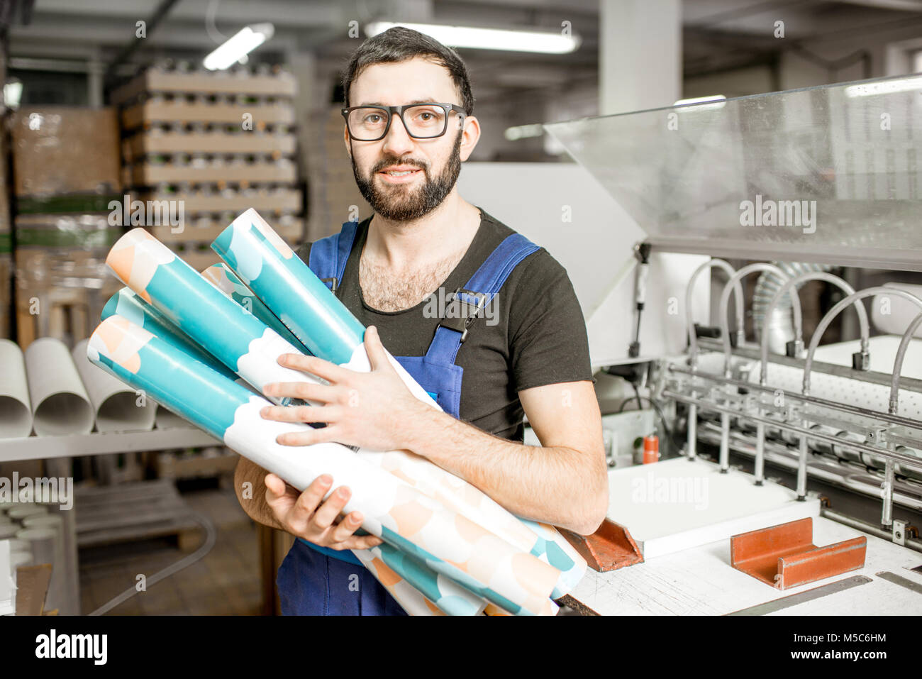 Worker portrait with paper tubes Stock Photo - Alamy