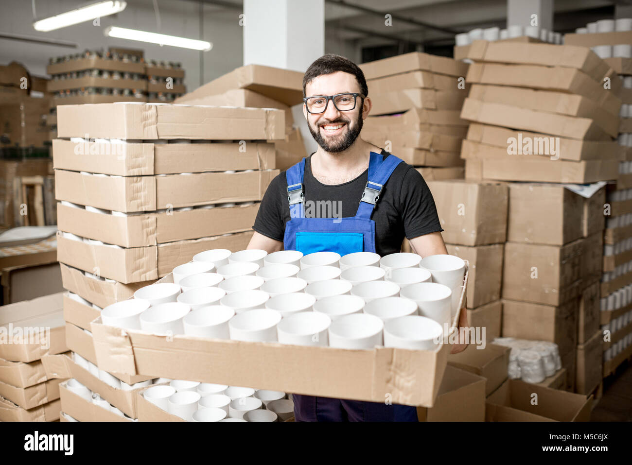 Worker portrait with paper tubes Stock Photo - Alamy
