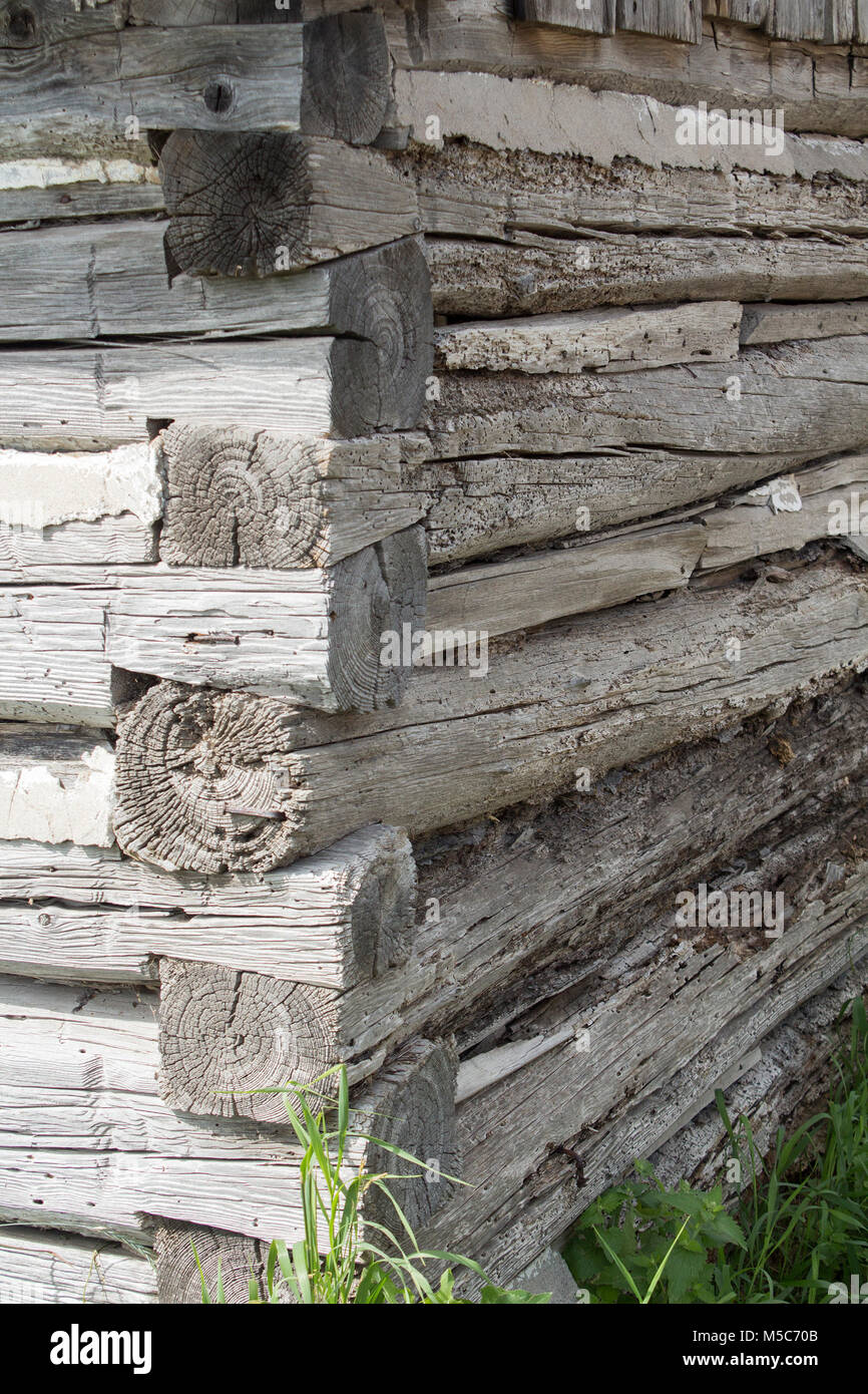 Corner of log building on farm in Ontario Canada showing hand built dovetail corner Stock Photo