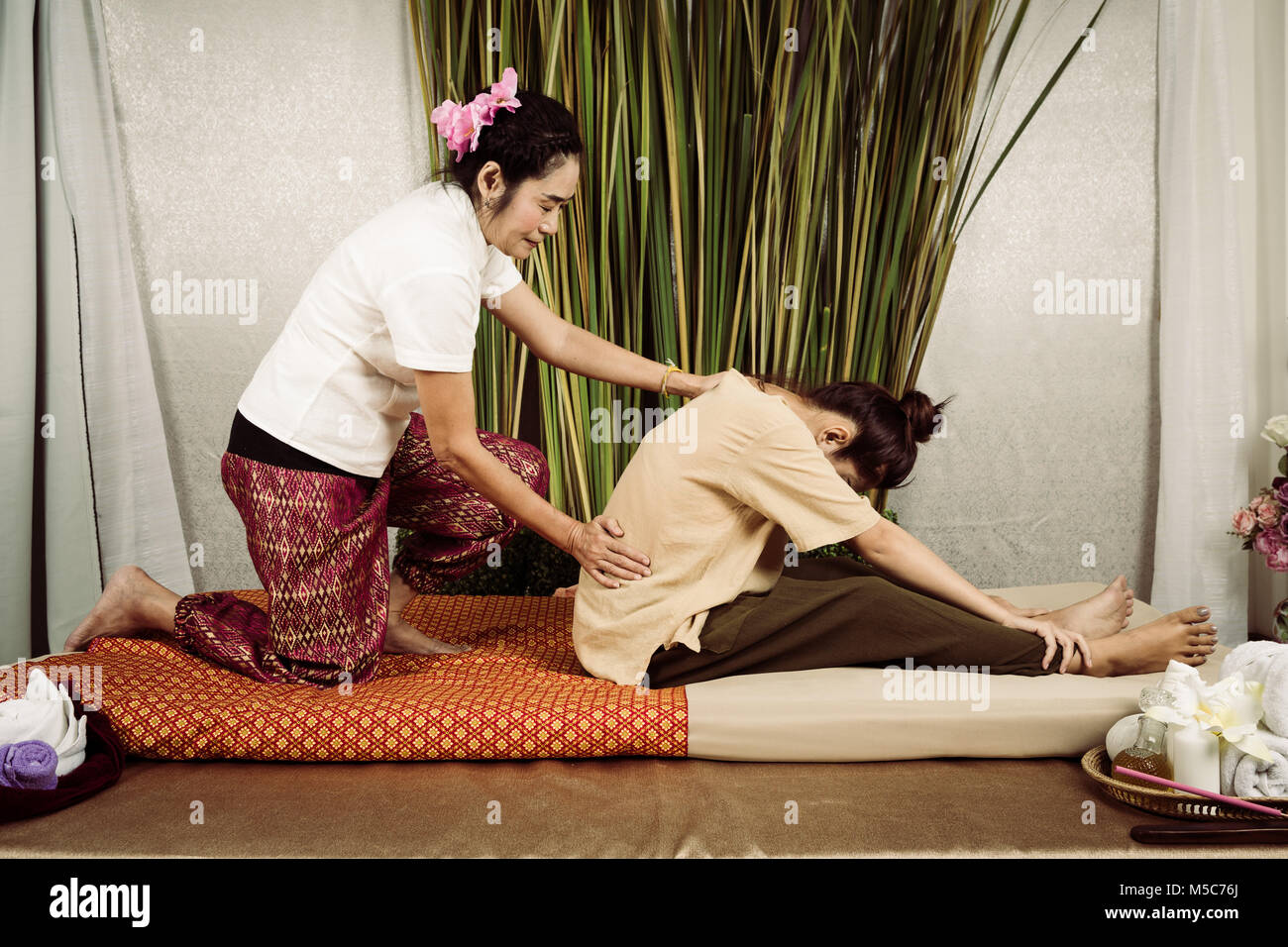 Young Asian girl get Thai style massage by Woman for body therapy Stock  Photo - Alamy