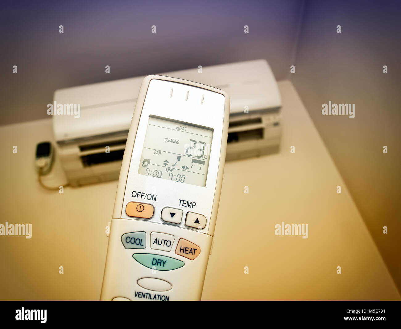 Remote control with air conditioning in the background. Stock Photo