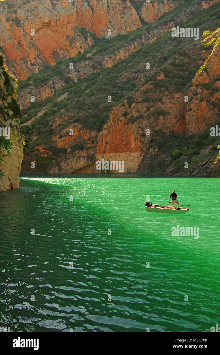 lure fisherman in a boat, alone in the wild. Bass fishing, fishing scene, wild fishing adventure Stock Photo