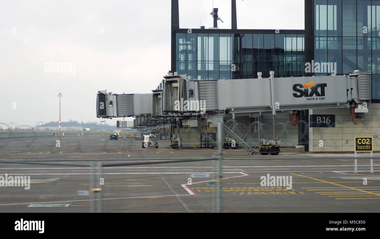 BERLIN, GERMANY - JAN 17th, 2015: Berlin Brandenburg Airport BER, still under construction, empty terminal building and a gangway, architecture tour Stock Photo