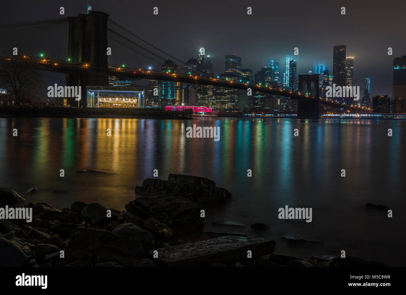 New York City Manhattan skyline and Brooklyn Bridge at night over ...