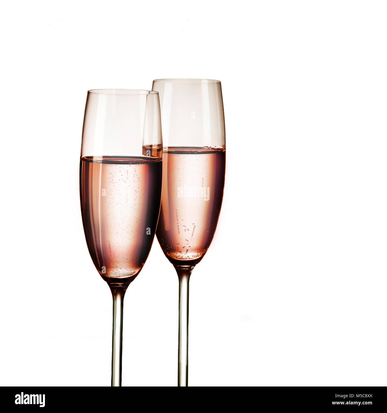 Pink champagne in two glasses, in detail, isolated on white background Stock Photo