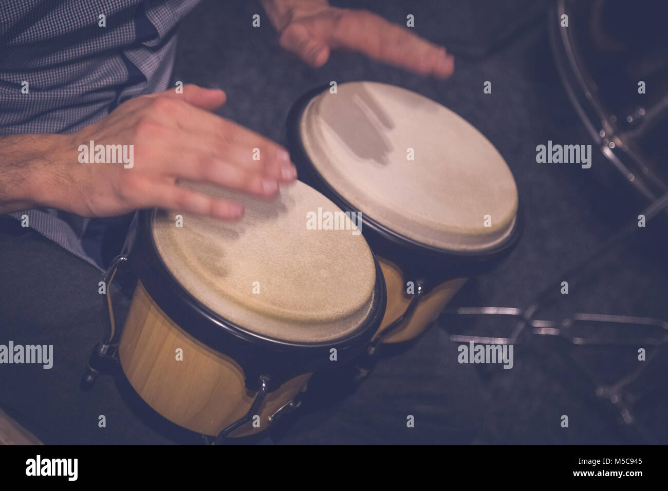 African playing traditional hand drums hires stock photography and