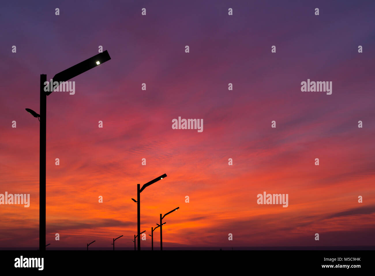 Street lights at sunset Stock Photo Alamy